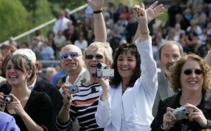 parents cheering for cheerleaders